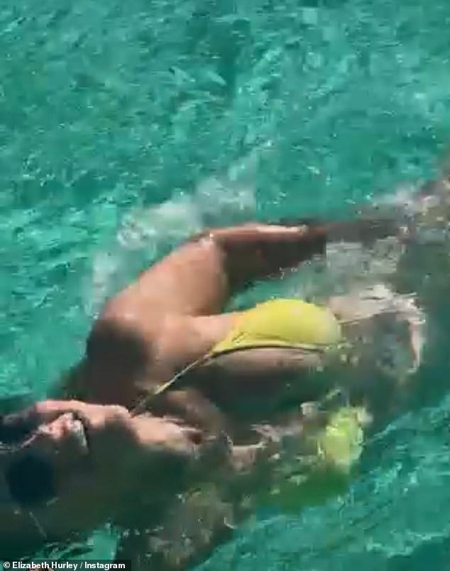 The actress oozed sex appeal as she showed off her incredible figure in a sparkling two-piece while sharing clips of herself swimming and relaxing on a jetty.