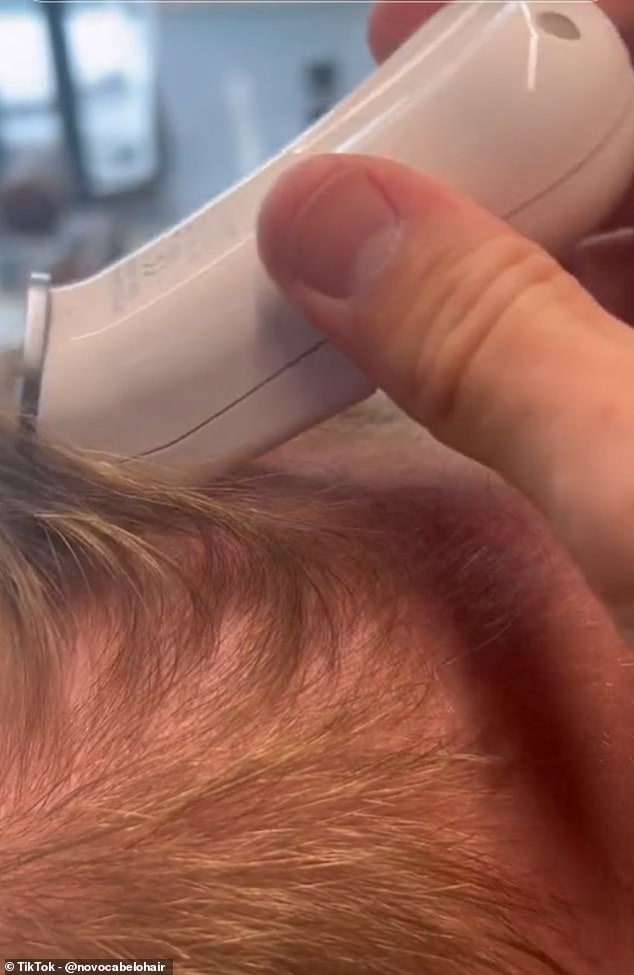 He put his trust in specialist barber Rob Wood, who cut his hair while installing a hair system that should last between four and six weeks (pictured: Rob cutting Gethin's hair)