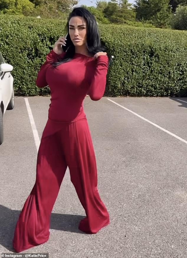 The glamorous model looked stunning in floor-length dark red baggy trousers and a matching off-the-shoulder top.