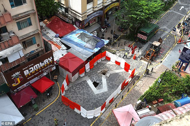 A day later, another sinkhole appeared 50 metres away. A geologist told local media Malaysiakini that it was probably related to the search efforts. (Pictured: new sinkhole on August 28)