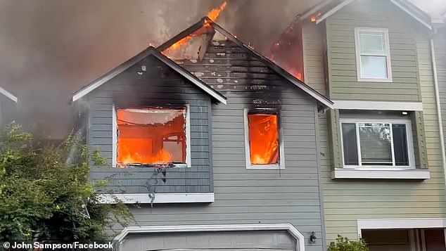 The video shows plumes of smoke rising over the area as flames shoot out of homes.