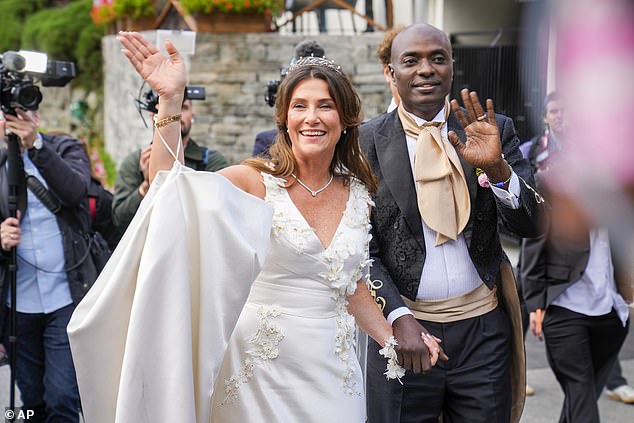 Greeting the press and the people who gathered in the streets to see them get married.