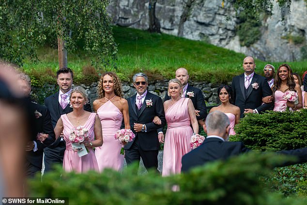 Close relatives and bridesmaids enter the Union Hotel in Geiranger