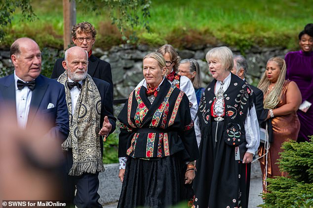 Guests in traditional dress attend the wedding of Princess Marta and Durek