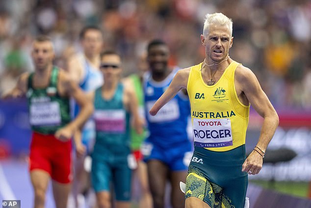 Australia's Michael Roeger (centre) finishes second in the 1500m T46 at the Stade de France