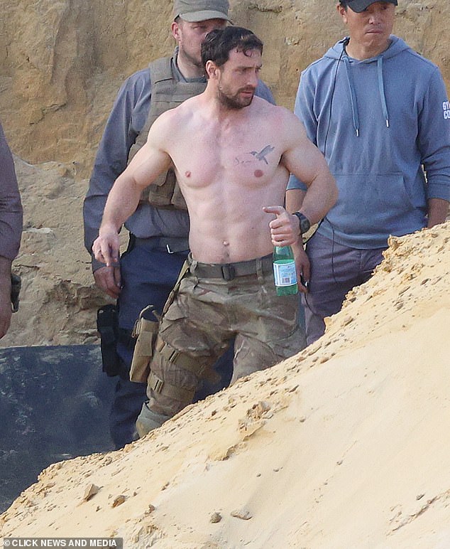 The actor is seen taking a sip of San Pellegrino sparkling water while filming the thriller.