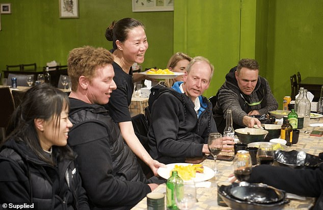 Hue, 54 (pictured serving customers) was sponsored in January 2015 to be head chef at a Vietnamese restaurant in Bathurst, New South Wales.