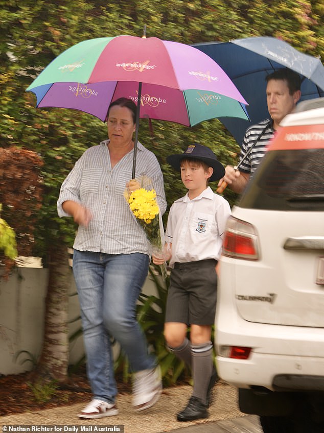 On Thursday morning, several children accompanied by their parents left flowers at the scene on their way to school.