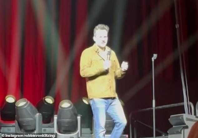 Shocking footage has captured the moment Australian comedian and TV presenter Jim Jefferies' jokes about US politicians including Donald Trump and Joe Biden sparked an angry response from an audience member.