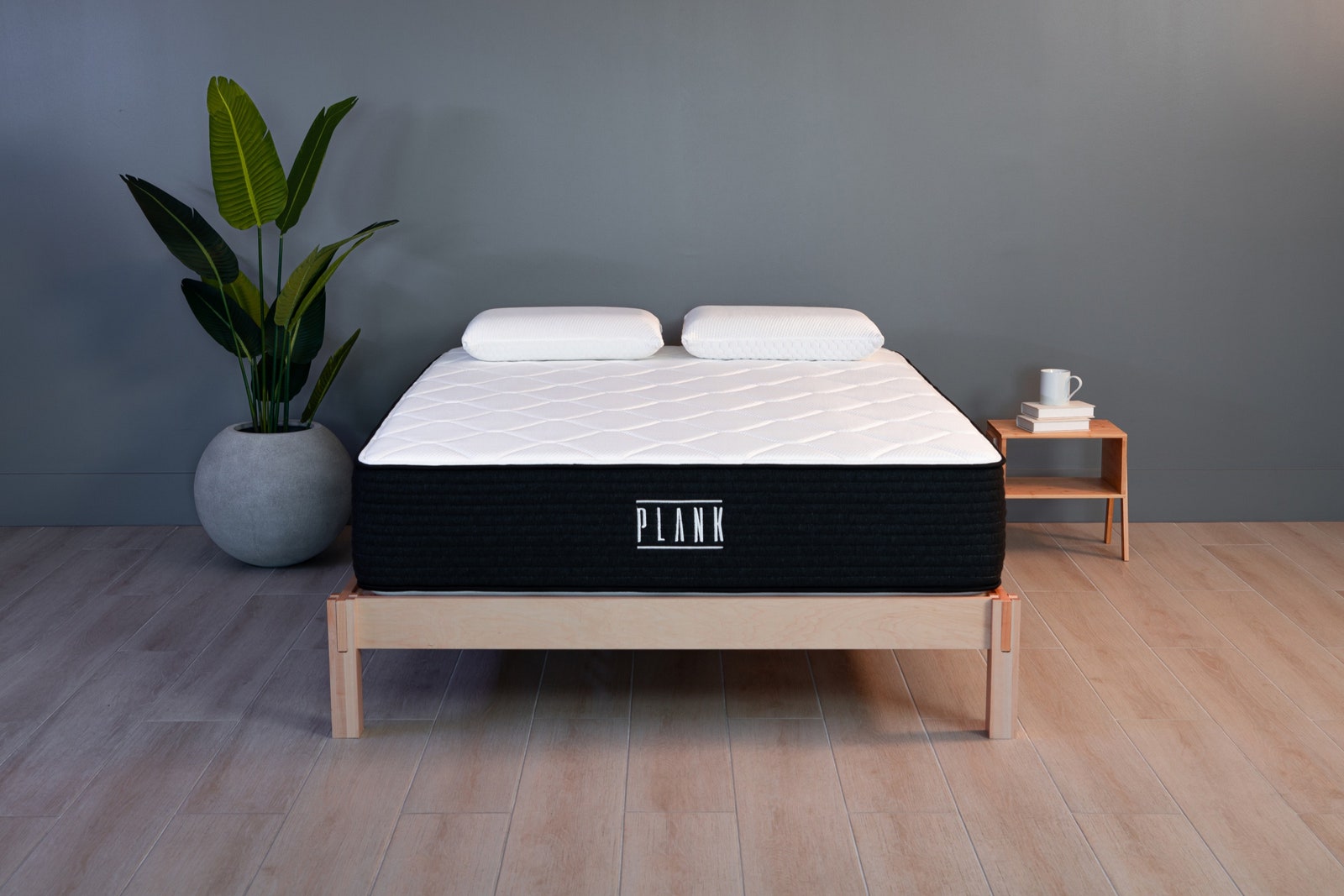 Plank Firm Luxe Mattress on Bed Frame