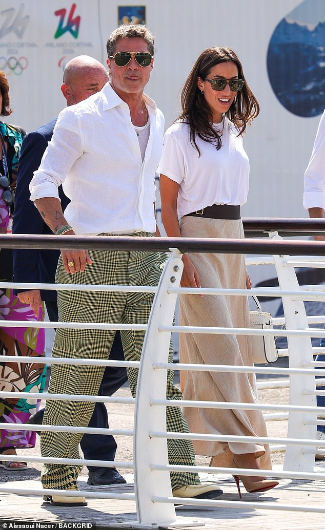 Brad completed the dapper look with a sleek white shirt and yellow loafers while shielding his eyes behind a pair of aviator sunglasses.