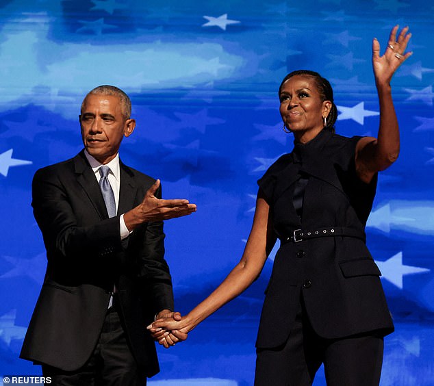 Thousands of excited Democrats cheered their political idols Barack and Michelle Obama in what one tearful delegate called 