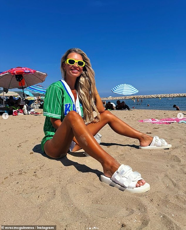 The blonde beauty looked gorgeous in nothing but an open green jumper and black bikini bottoms as she smiled for the camera.