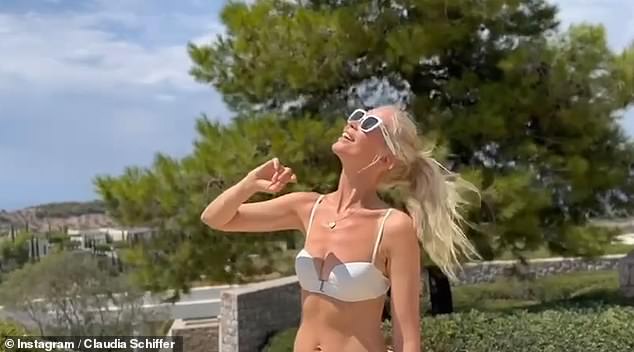 The model celebrated her 54th birthday by sharing a video online of herself posing in a two-piece suit while on vacation in Greece.