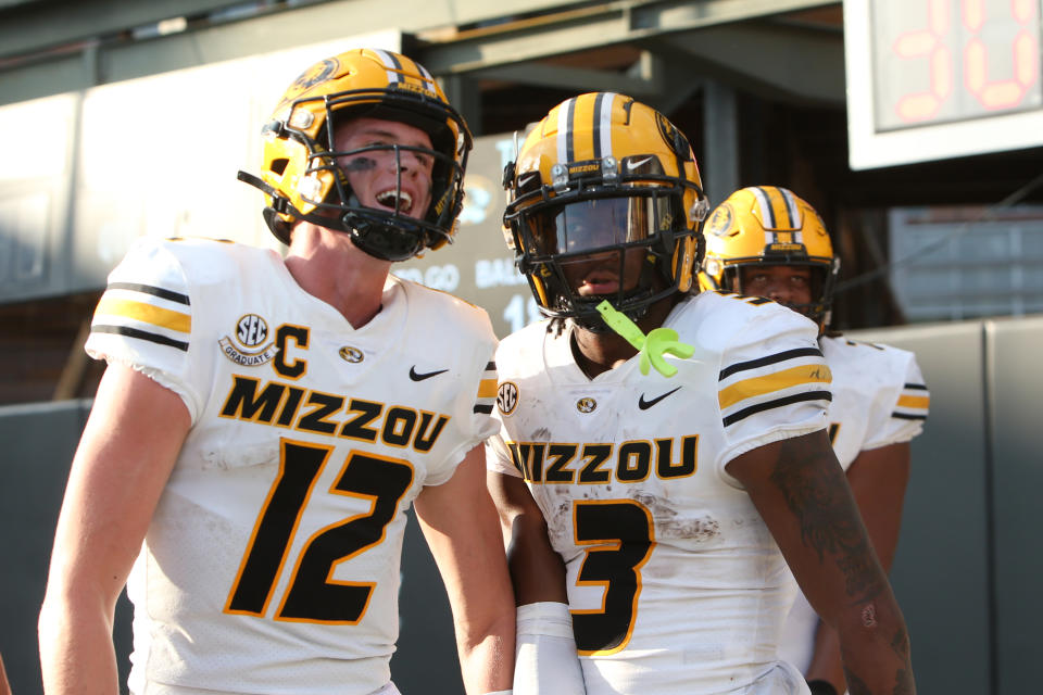 NASHVILLE, TN - SEPTEMBER 30: Missouri Tigers wide receiver Luther Burden III (3) is congratulated by Missouri Tigers quarterback Brady Cook (12) after scoring a touchdown during a game between the Vanderbilt Commodores and the Missouri Tigers on September 30, 2023 at FirstBank Stadium in Nashville, Tennessee. (Photo by Matthew Maxey/Icon Sportswire via Getty Images)