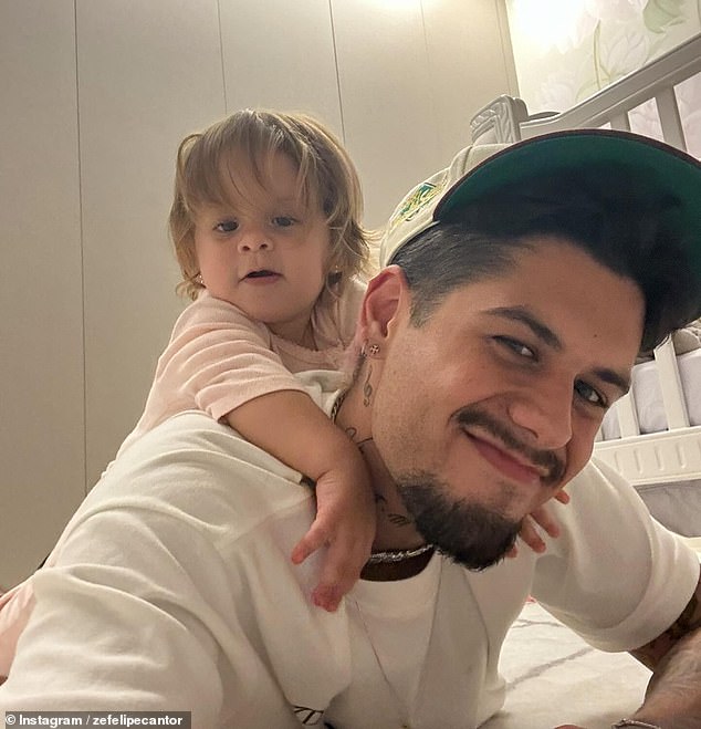 Zé Felipe said his one-year-old daughter, María Flor (pictured), was playing on a pool float when she slipped and fell into the pool.