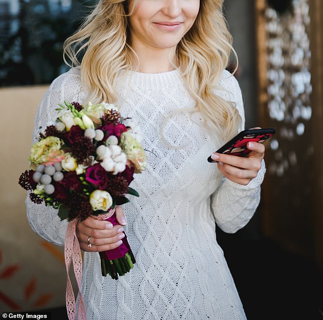 Bride randomly checked her phone on her wedding day, only to discover she no longer had a job (file image)