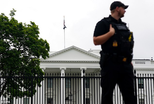 A Secret Service agent outside the White House, Washington, DC.