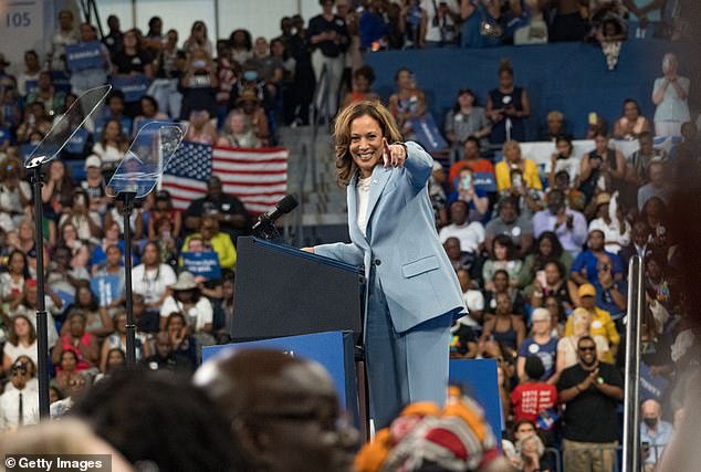 A new poll shows that for the first time this election cycle, voters trust the Democratic nominee more than Trump when it comes to the economy. Pictured: Kamala Harris in Georgia on July 30