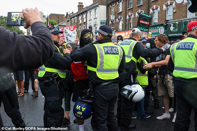 Thousands of anti-racism protesters outnumbered far-right opponents on the streets of Britain last night, as those behind the rallies targeting immigration centres tried to backtrack on the planned gatherings.