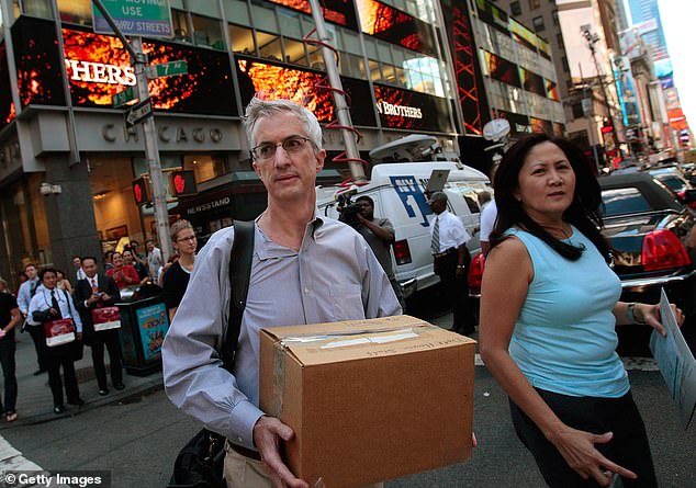 Rosenberg predicts the U.S. economy is headed for another recession, with a slumping labor market as the catalyst. Pictured here, a Lehman Brothers employee leaves the office on Sept. 15, 2008, the day the bankrupt financial services firm filed for bankruptcy.