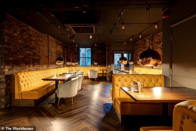 Inside The Washhouse is a dimly lit bar offering an extensive cocktail menu.