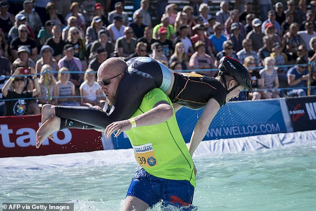 In Sonkajärvi, Finland, men tie their wives behind their backs, as seen above, and complete an obstacle course.