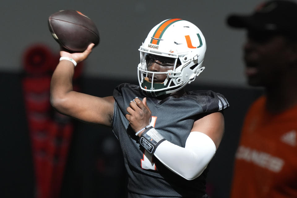 There are high hopes for Coral Gables this season after quarterback Cam Ward transferred to Miami from Washington State. (AP Photo/Marta Lavandier, File)