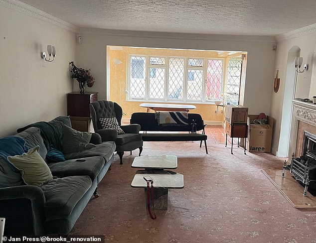 Before the couple ripped out the carpet, the living room was decorated with a pale pink floral rug.