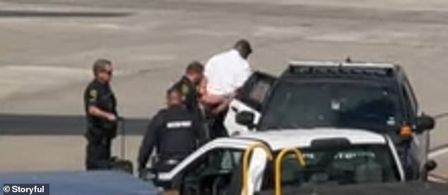 A Frontier Airlines pilot was detained by Houston police aboard a plane at George Bush Intercontinental Airport on Saturday.