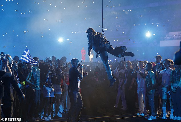 Actor Tom Cruise performs during the closing ceremony