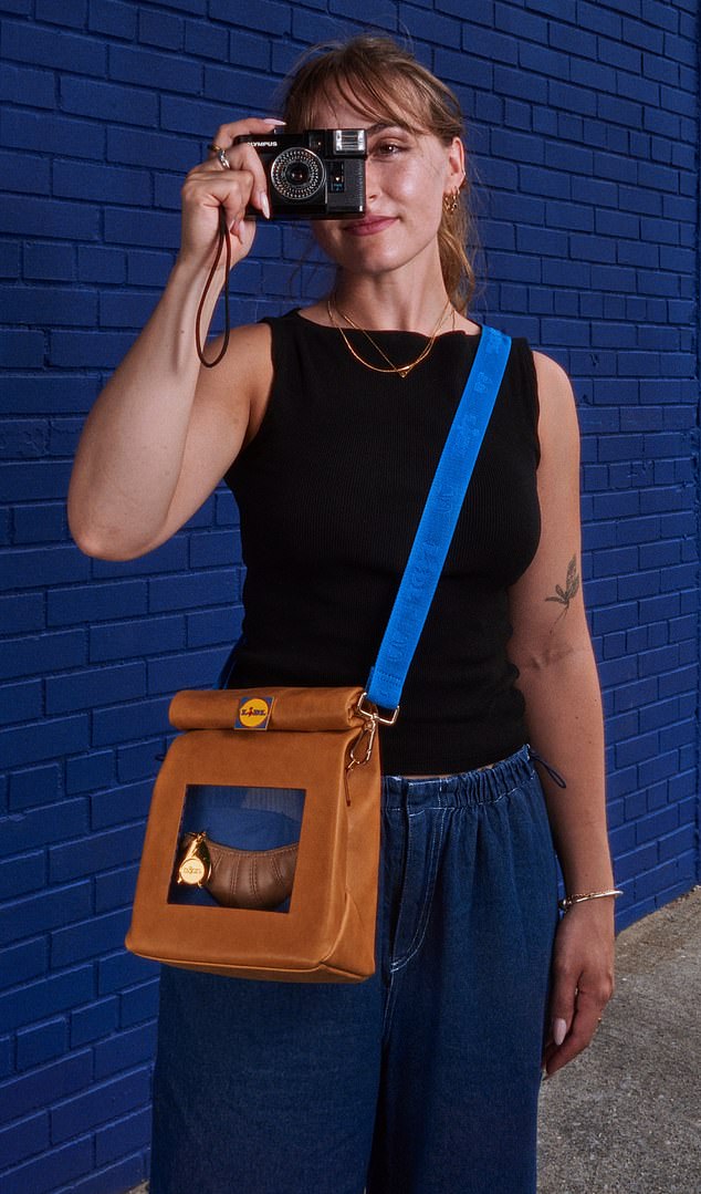 The bag is shaped like a roll-top bakery bag and comes with a croissant-shaped wallet inside.