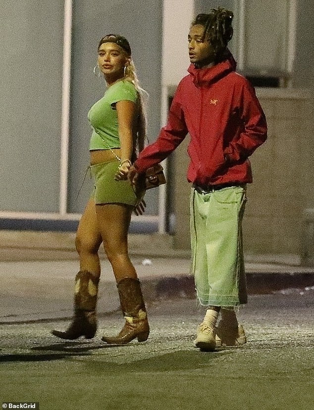 Jada Pinkett Smith and Will Smith's son wore a red hoodie with a pair of bright green baggy, cropped pants.