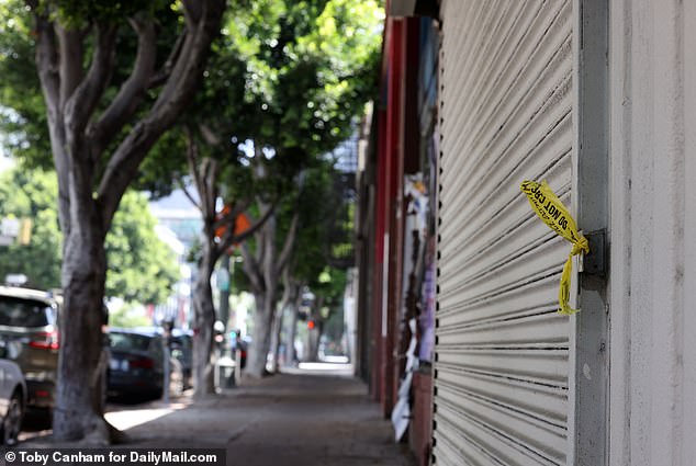 Exclusive photos from DailyMail.com also show the desolate spot where the star lost his life, with a tattered piece of police tape still on the front of a nearby shop covered in graffiti.