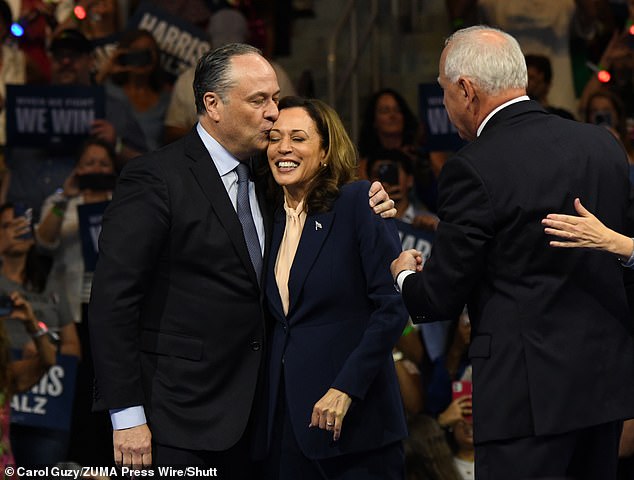 The couple stood united amid scandal in Philadelphia on Tuesday as the presidential candidate introduced her vice presidential nominee, Tim Walz.