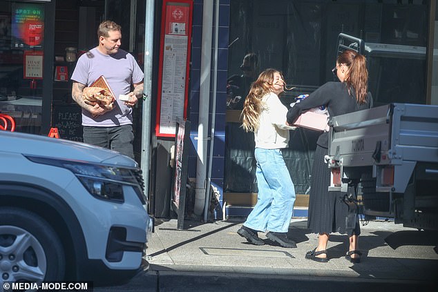 Daughter Mae seemed very excited to see her famous mom and the gifts she bought, as the 10-year-old was seen running to help carry them.