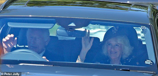 He seemed in good spirits as he and Camilla made the short drive to the church, lifting his hand from the wheel to wave.