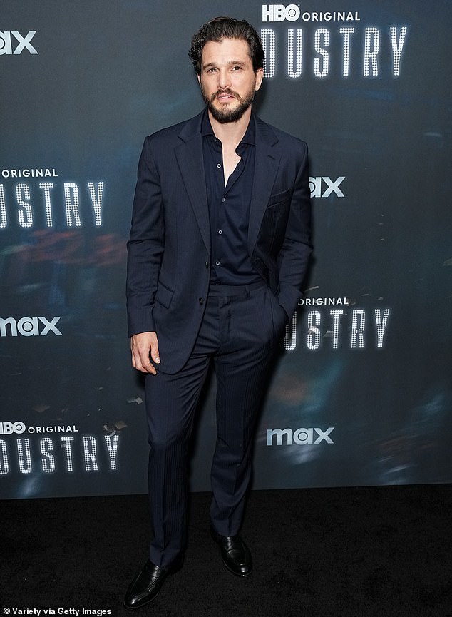 While attending the latest premiere of his drama at The Metrograph Theatre, Kit looked dapper in a navy suit and matching open-neck shirt.