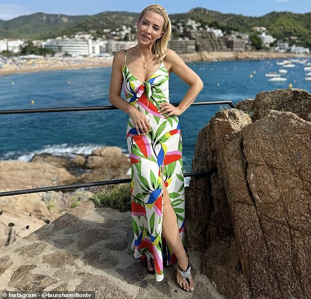 Earlier this week, Laura took to Instagram to share a photo of herself wearing a botanical print dress to which she added sparkly black sandals.