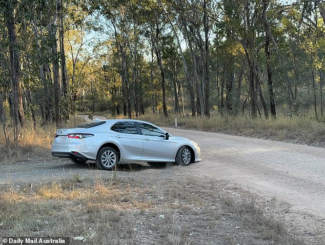 A police car is seen leaving the house on Thursday.