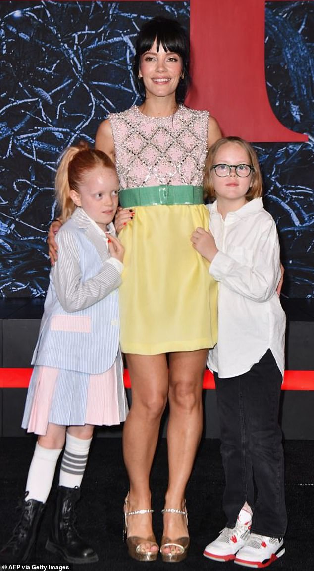 Lily said: 'Because my children's father lives in England, I couldn't take them to see their dad for about four or five months' (pictured with Marnie, left, and Ethel, right, in 2022).