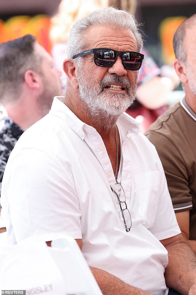 The veteran actor was seen with grey hair, a scruffy beard and prescription glasses hanging from his top.