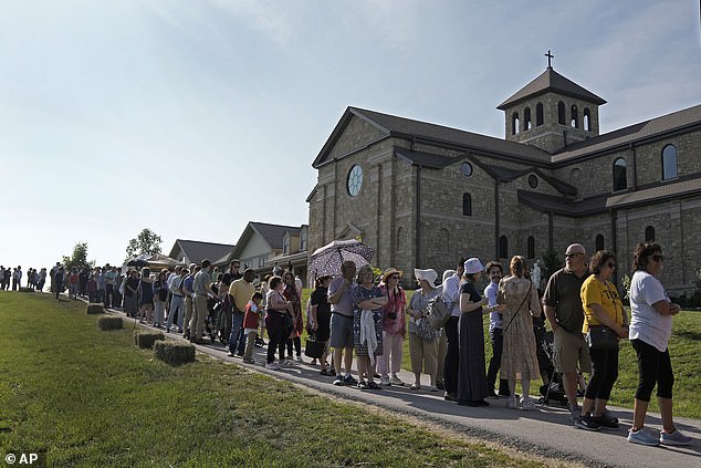 People wait to view the body of Sister Wilhelmina Lancaster at the Benedictine Abbey of Mary, Queen of the Apostles on Sunday