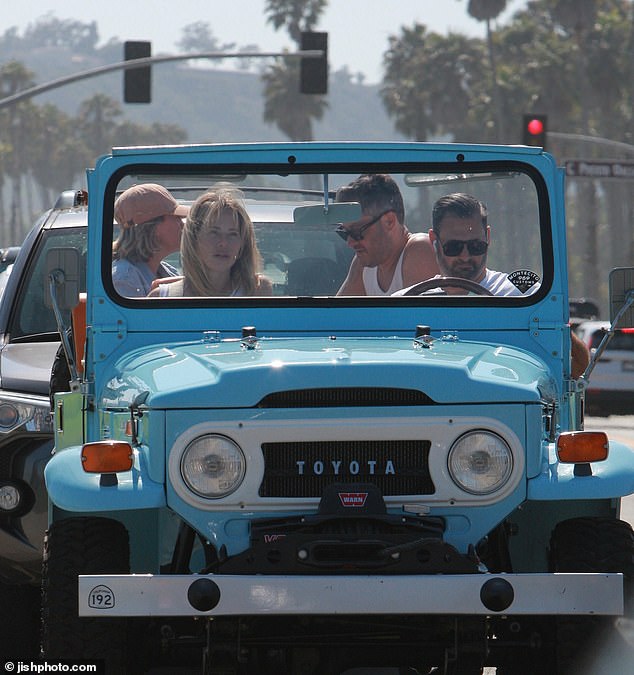 Dina and her husband, businessman and chief investment officer David Cantin, 44, as they took friends for a joyride in a light blue Toyota Land Cruiser FJ-40.