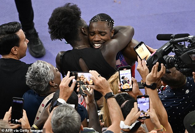 Lyles celebrates with Bromfield after winning gold in the 100m in a dramatic final on Sunday