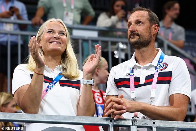 Mette-Marit, who also accompanied her husband on Friday to watch the athletics events, showed her enthusiasm by waving to the crowd as she stood by the Prince, despite the news of her son's arrest.