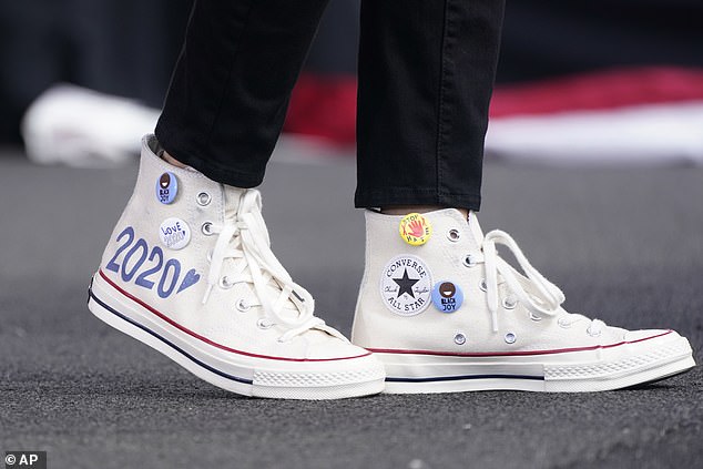 Democratic vice presidential nominee Sen. Kamala Harris' (D-Calif.) Converse high-top sneakers are shown as she speaks at a drive-thru early voting event.