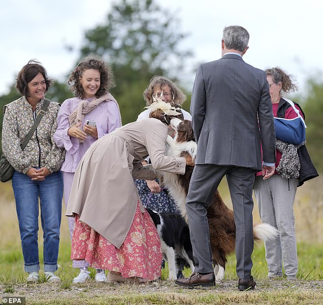 Queen Mary was given a tour of the city, greeting fans and helping some children plant a tree before turning her attention to two tail-wagging collies.