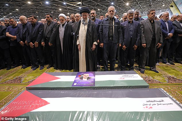 Iran's Supreme Leader Ayatollah Ali Khamenei leads a prayer at the coffins of Hamas leader Ismail Haniyeh and his bodyguard, who were killed in an assassination blamed on Israel.