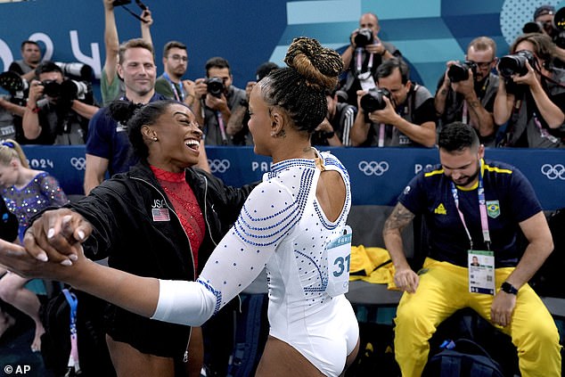 Biles and her main rival Rebeca Andrade embraced during the vault final on Saturday